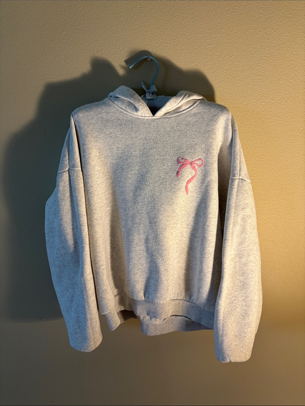 Edikted Light Gray Hooded Sweatshirt with Pink Bow Chest Accent